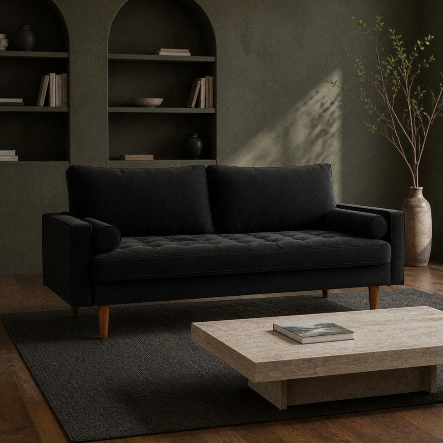 In a room | black velvet tufted sofa in an olive library with a travertine coffee table