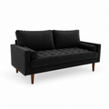 Studio | front-left studio view of black velvet sofa showing the square arm, tufted bench seat, two loose back cushions, and brown wood legs