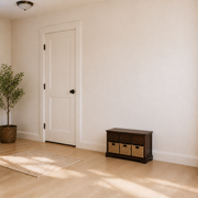 Scale | dark cherry storage bench beside a full-height white interior door for scale