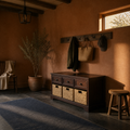 In a room | dark cherry wood storage bench in a terracotta mudroom with slate floor and wall hooks