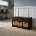 In a room | dark cherry storage bench in a blue-gray hallway with white paneling