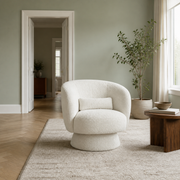 In scale | cream white boucle swivel chair beside an uncropped full-height interior doorway