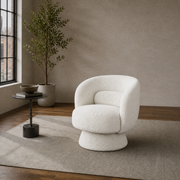 Room one angle | cream white boucle swivel chair turned to show its rounded side and pedestal base