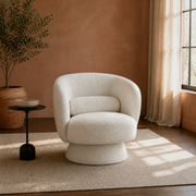 Room two | cream white boucle swivel barrel chair in a clay-toned living room