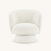 Studio front | cream white boucle swivel chair with rounded barrel back, bolster pillow and wrapped drum base