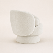 Studio side | cream white boucle swivel chair showing its rounded rear profile and wrapped pedestal base