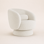 Studio three-quarter | cream white boucle chair turned to show its rounded side and wrapped drum pedestal base