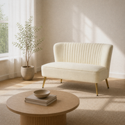 Living room angle | Ivory velvet armless loveseat from a three-quarter angle with a pale oak coffee table