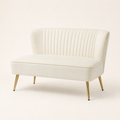 Studio angle | Three-quarter studio view of the ivory velvet armless loveseat with gold metal legs