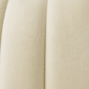 Texture | Ivory velvet upholstery with a vertical channel seam