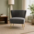 Living room | Grey velvet channel-tufted accent chair in a sage green room with a walnut side table
