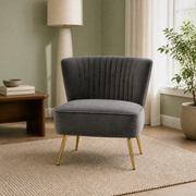 Living room | Grey velvet channel-tufted accent chair in a sage green room with a walnut side table