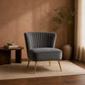 Living room | Grey velvet channel-tufted accent chair in a clay-toned room with a dark walnut side table