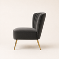 Side | Grey velvet accent chair side profile showing the flared back, seat depth, and tapered gold legs