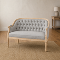 Warm room | Midnight black faux leather loveseat in a terracotta garden room with arched window and plain indigo rug