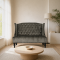 In a room | charcoal gray velvet diamond-tufted wingback loveseat in a warm-white living room