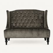 Front | straight-on studio view of the charcoal gray velvet diamond-tufted wingback loveseat with black legs