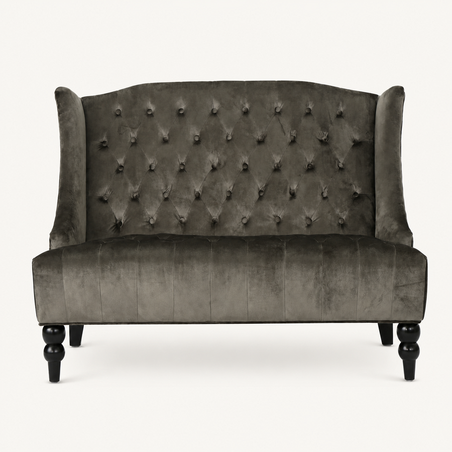 Front | straight-on studio view of the charcoal gray velvet diamond-tufted wingback loveseat with black legs