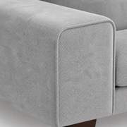 Square arm | Extreme close-up of the upholstered square arm corner and its stitched seam