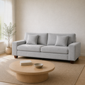 Room angle | Light gray chenille sofa from the front-right in the warm pale-oak living room