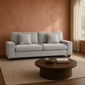Room | Light gray chenille sofa in a terracotta living room with a dark wood coffee table