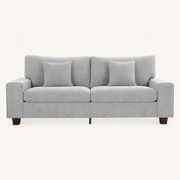 Front | Light gray chenille sofa front view in a warm off-white studio with square arms and two matching throw pillows