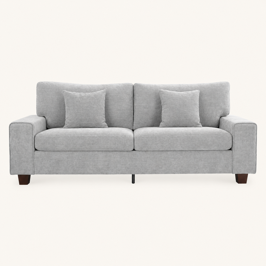 Front | Light gray chenille sofa front view in a warm off-white studio with square arms and two matching throw pillows