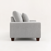 Side | Left-side studio view showing the square arm, back cushion profile, black center support, and brown wood legs