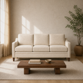 Warm ivory living room | beige three-seat sofa with dark wood coffee table