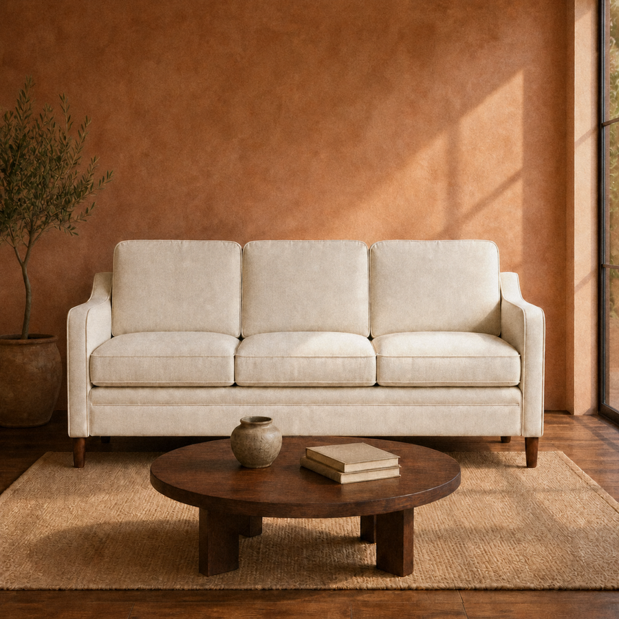 Terracotta living room | beige three-seat sofa with dark wood coffee table