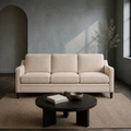 Blue-gray living room | beige three-seat sofa with dark coffee table