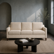 Blue-gray living room | beige three-seat sofa with dark coffee table