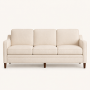 Studio front | beige three-seat sofa with three seat cushions and brown tapered legs