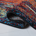 Rolled edge | the rug curled back on a white floor to show the backing