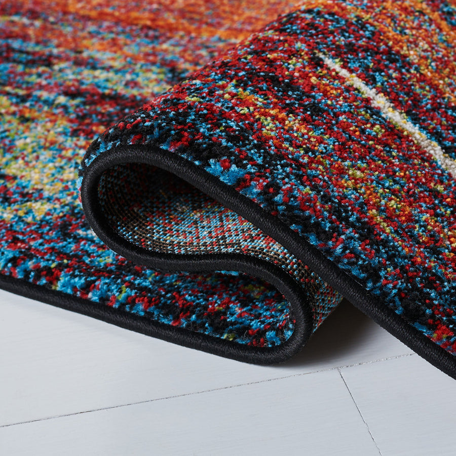 Rolled edge | the rug curled back on a white floor to show the backing