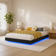 Room 2 angle | Angled bright-room view of the fluted bed, nightstands, and blue under-bed light