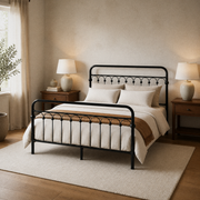 Three quarter | Black metal bed viewed from the foot corner in a warm bedroom