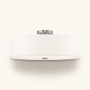 Front | studio front of the white drum and brushed nickel canopy