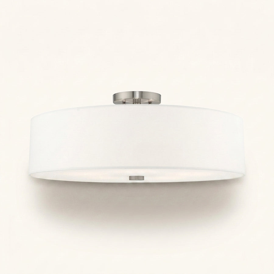 Front | studio front of the white drum and brushed nickel canopy