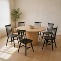 In a room | the set of six pulled up to a pale-oak dining table, soft morning sidelight from the left window