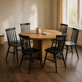 In a room | the set beside a round table in a warm plaster dining room, low afternoon light