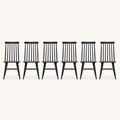 Front | all six black Windsor dining chairs centered on paper, seven-spindle backs and H-stretchers visible
