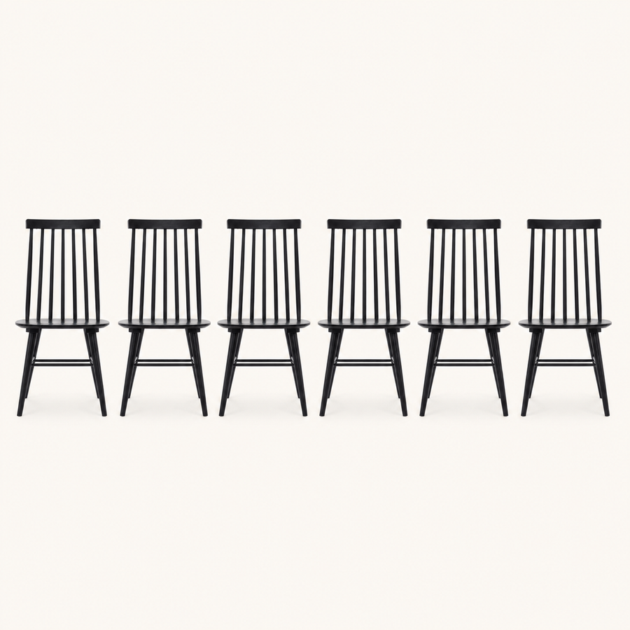 Front | all six black Windsor dining chairs centered on paper, seven-spindle backs and H-stretchers visible