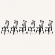 Studio | the chairs at a true three-quarter angle, spindle-back depth and the H-stretcher both reading