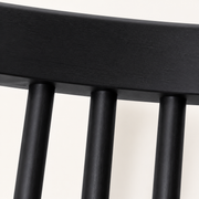 Closer | matte black finish and wood grain where the spindles meet the crest rail