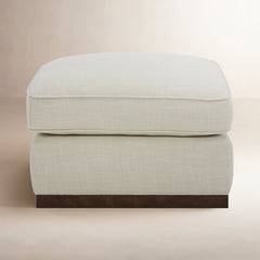 Upholstered Rectangular Ottoman with Walnut Finish Plinth Base