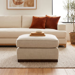 Upholstered Rectangular Ottoman with Walnut Finish Plinth Base
