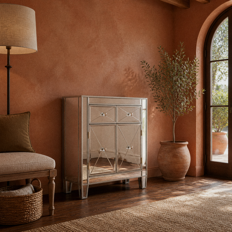 Terracotta room | silver mirrored cabinet in a clay-walled garden room