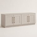 Angle | front-left studio view showing all four doors, antique-brass pulls, top plane, side depth, and plinth base