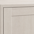 Material close-up | pale Alder White surface with subtle straight wood grain and a crisp recessed-panel edge